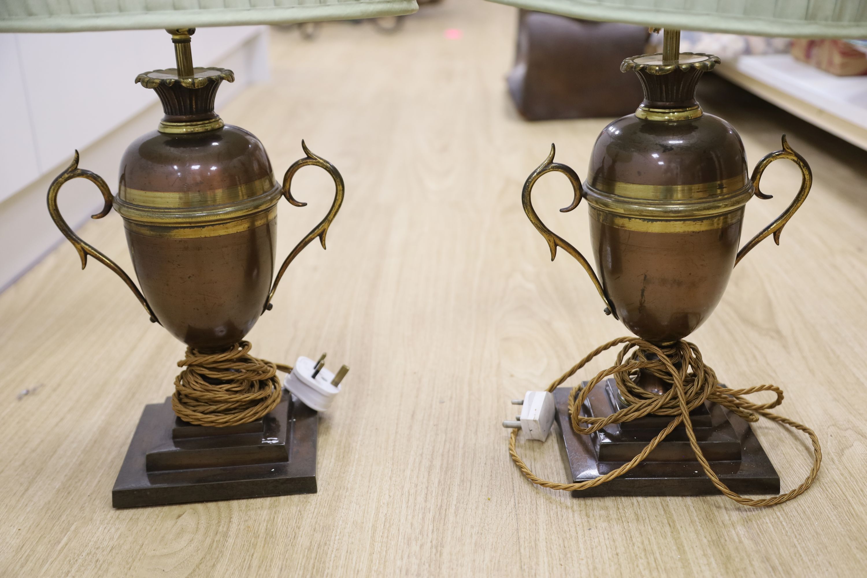 A pair of copper and brass table lamps, height 35cm